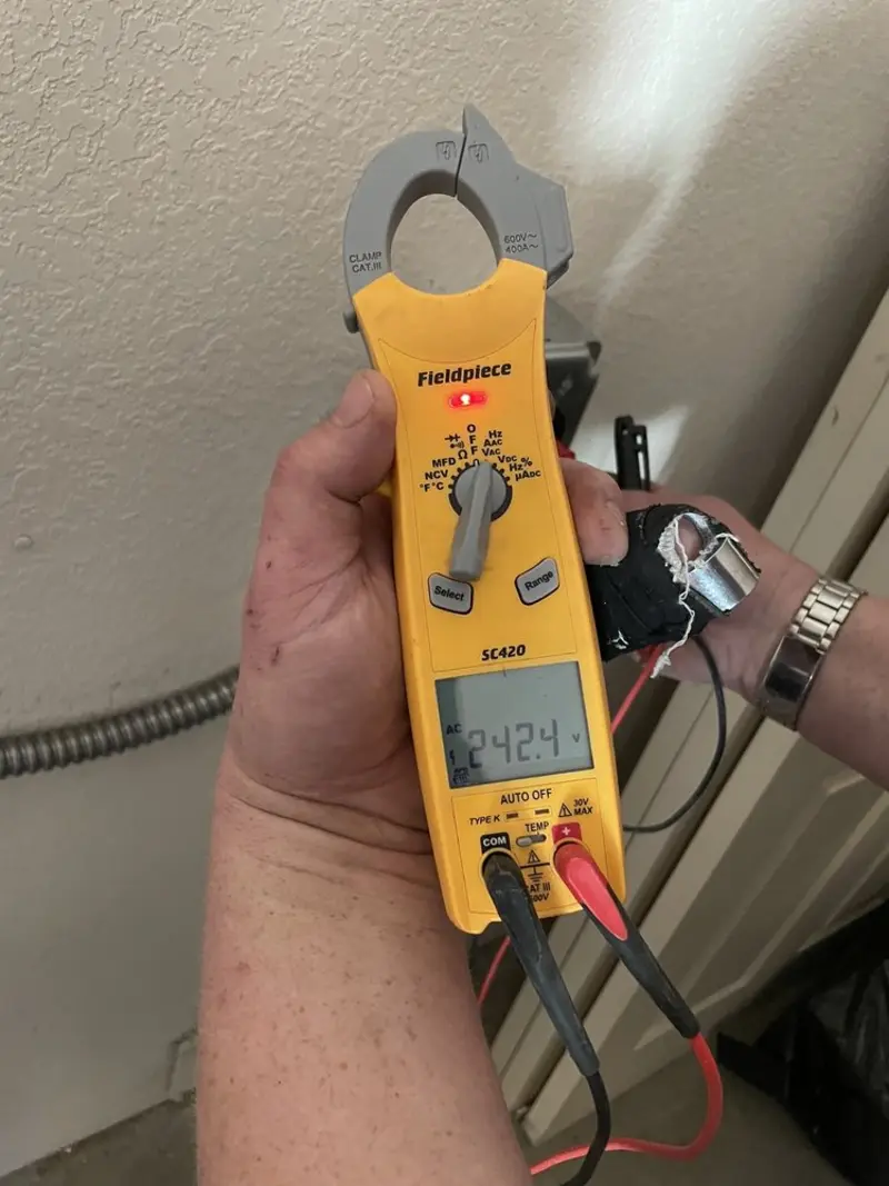 Voltage testing with clamp meter during Electrical Installation Services in Fruit Heights
